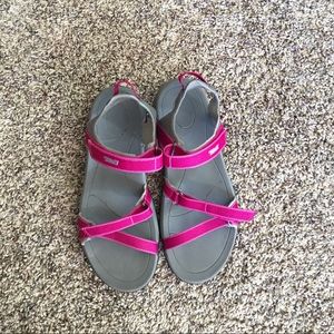 Pink and grey Teva sandals.